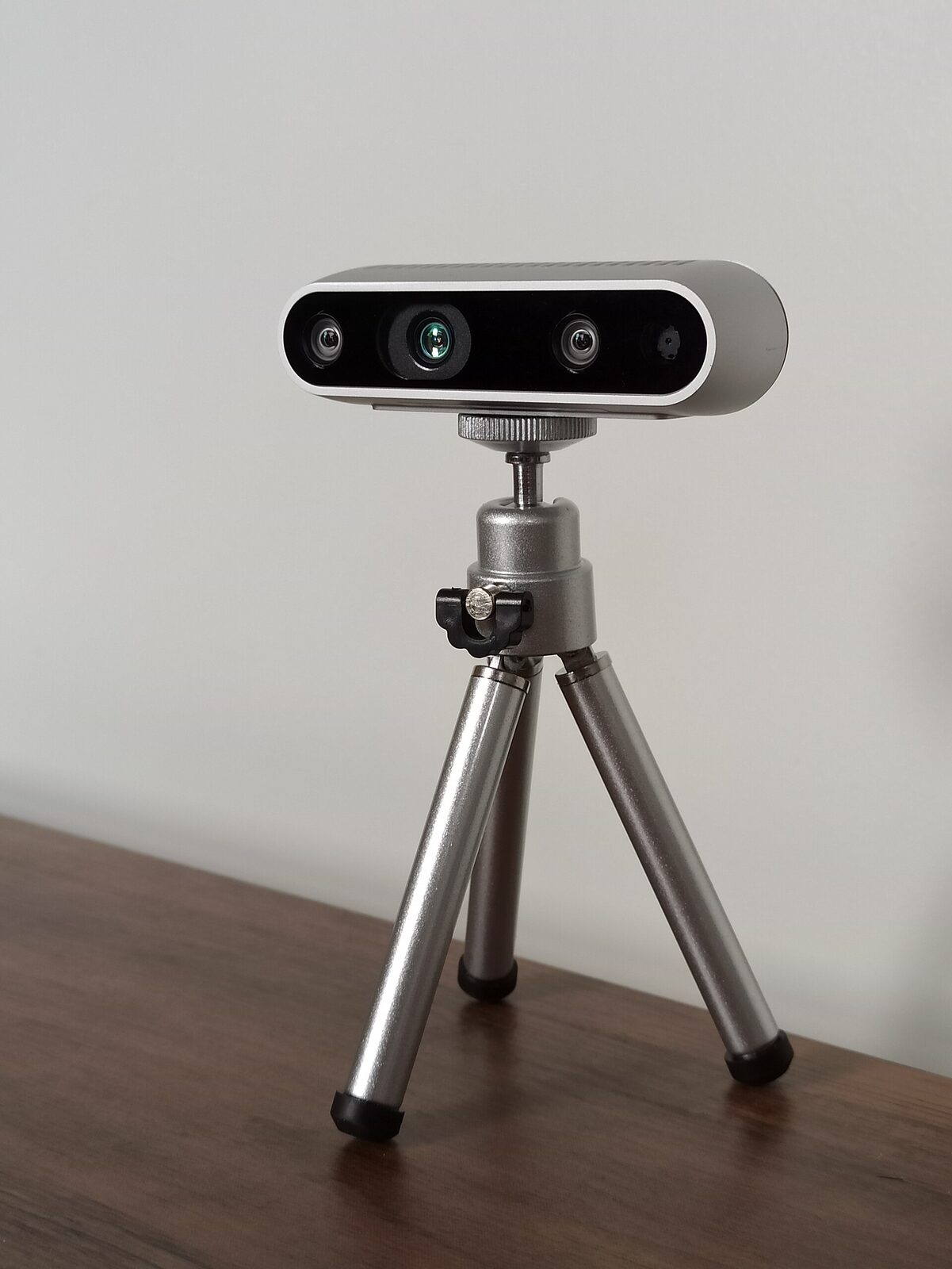 A depth camera mounted on a small tripod